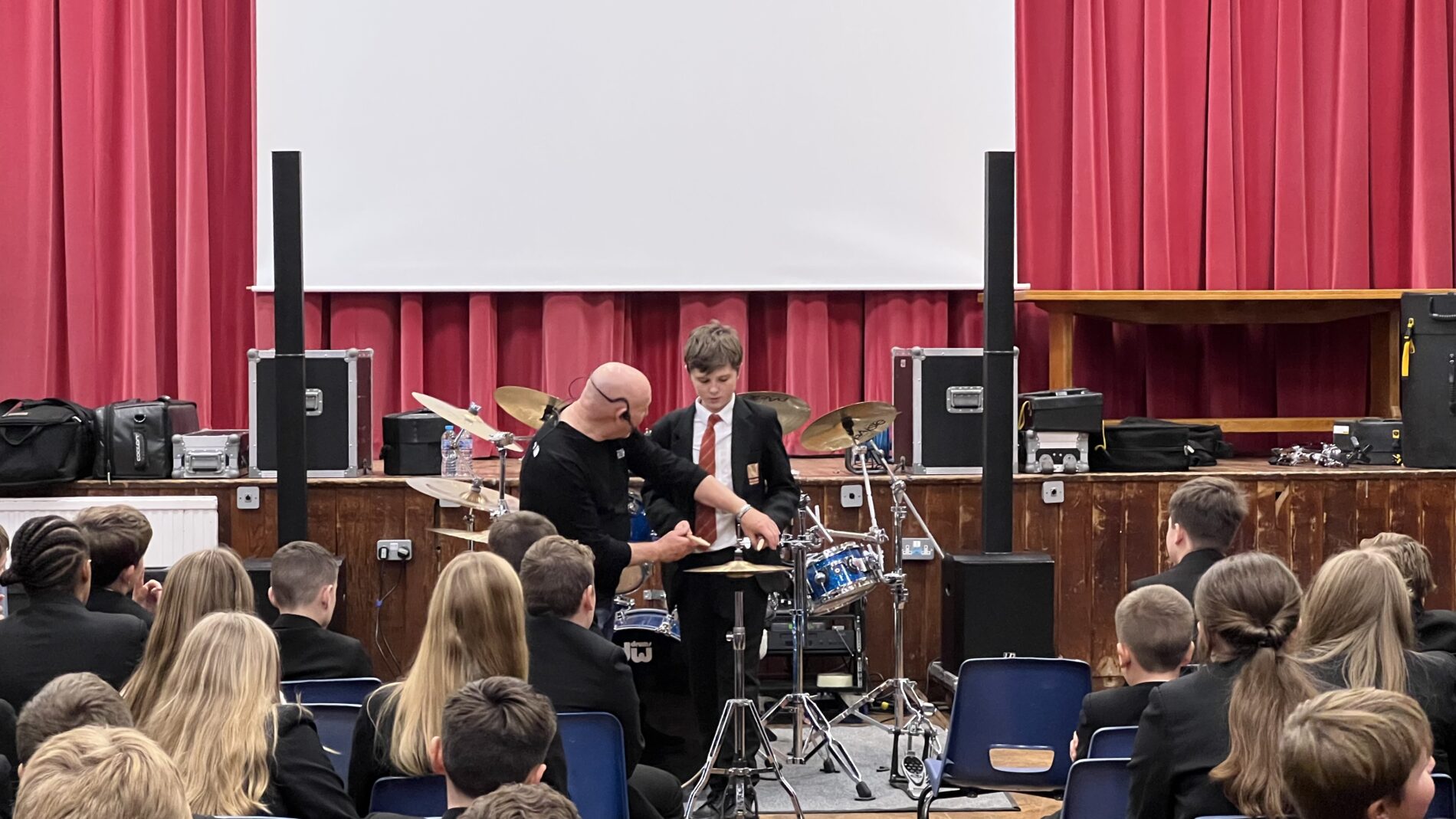 Jeff and student drumming together