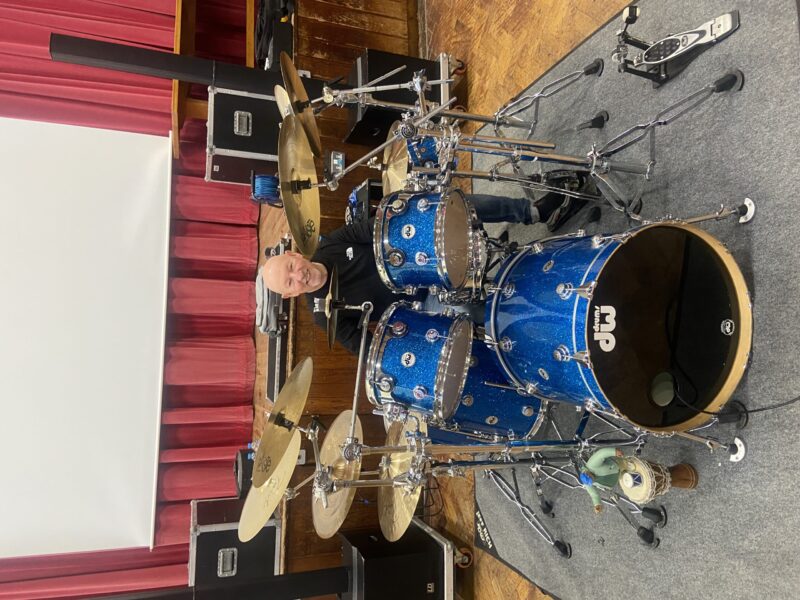 Jeff Rich performing for students at Moorside High School